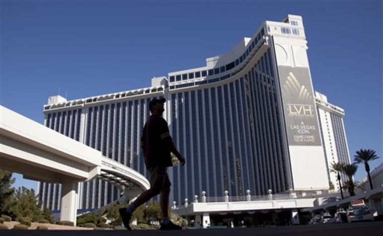 A hotel guest walks around the grounds of the Las Vegas Hotel and Casino on Tuesday in Las Vegas. The hotel is no longer affiliated with the Hilton.